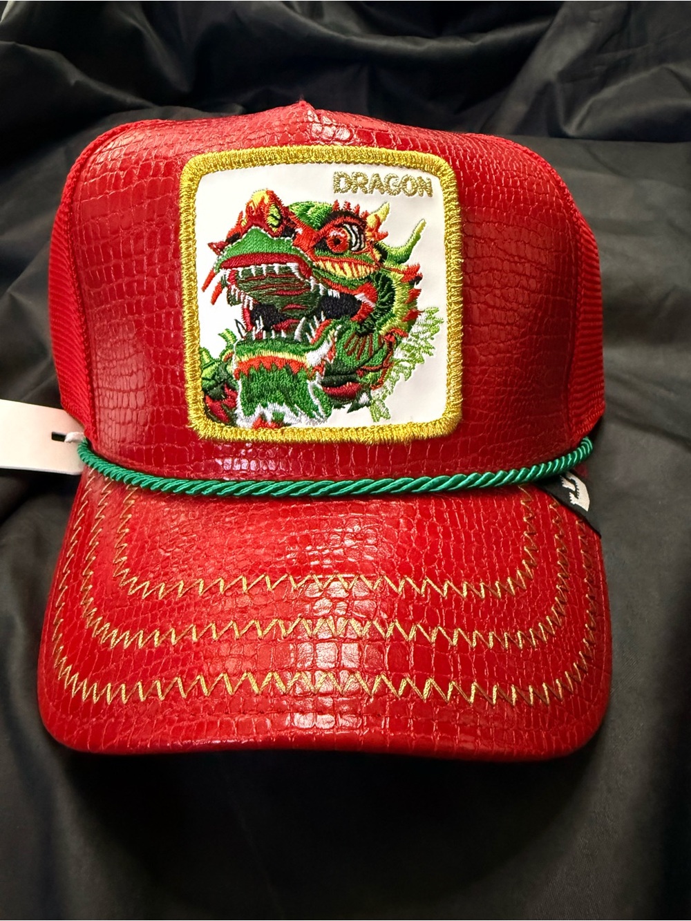 Goorin Bros Red Dragon Patch Trucker Hat with Green Rope